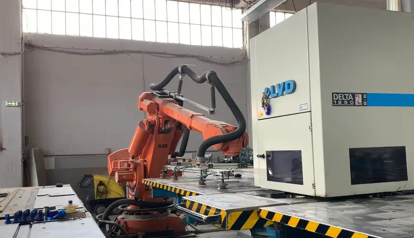 Automation Robot In Metal System Factory that produces armored / security doors
